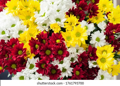 A bouquet of chrysanthemums. Multi-colored bouquet of flowers. Selective focus. Resale of flowers. Bouquet as a gift.
