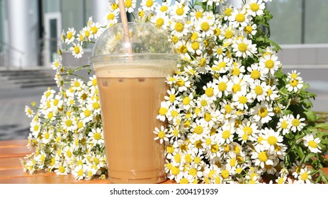 
A Bouquet Of Daisies With Cold Coffee