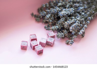 Bouquet Of Dried Lavender And Aroma Purple Lilac Wax Cubes Candles Lying On Pink Background, Aromatherapy, Close Up, Copy Space