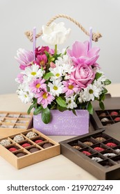 Bouquet Of Flowers With Chocolate Box Assorted. Flowers Spring And Handmade Chocolates Candy - Gift For Celebration