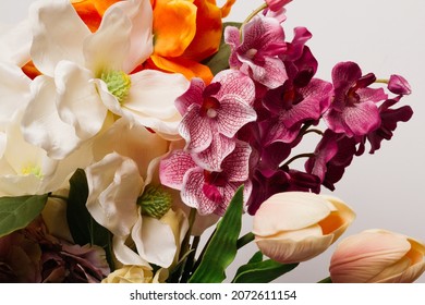 bouquet of flowers in a glass vase on a wooden table. wallpaper for a holiday card or calendar on the occasion of mother's day or international women's day. plants for the interior in the living room. - Powered by Shutterstock