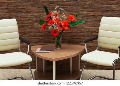 bouquet of flowers on a table in a modern office - Powered by Shutterstock