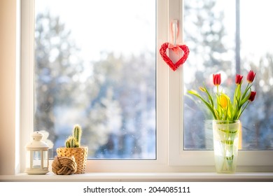 A Bouquet Of Flowers Is On The Window. Outside The Window, A Sunny Frosty Snowy Morning