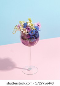 A Bouquet Of Flowers In A Wine Glass. Creative Concept Of Winemaking.