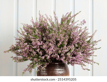 bouquet of forest heather is a close-up as a floral background. flowering branches in a vase. - Powered by Shutterstock