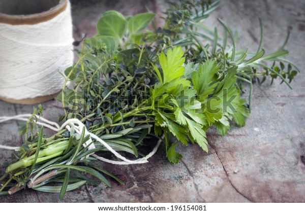 Bouquet garni of fresh herbs, tied with twine. \
Rosemary, thyme, oregano,\
parsley.