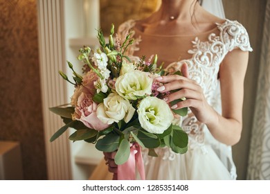 bouquet in hands of the bride, woman getting ready before wedding ceremony - Shutterstock ID 1285351408