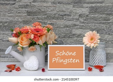 Bouquet with a heart and the text Frohe Pfingsten, Frohe Pfingsten means Happy Pentecost.
				
