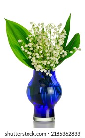 Bouquet of lilies of the valley in a blue vase on an isolated white background. Isolated floral still life with white flowers in a glass vase. - Shutterstock ID 2185362833