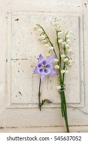 Bouquet Of Lilies Of The Valley And Columbine Flower On The Wooden