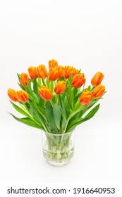 Bouquet of orange tulips on whtie background 