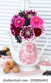 Bouquet Of Pink Dahlia Flowers In Vintage Coffee Can