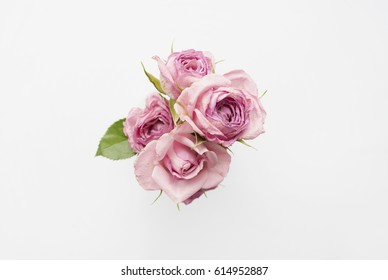 Bouquet of pink roses on a white background. Minimal composition. Flat lay - Shutterstock ID 614952887