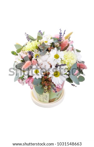 Bouquet in a pot of yellow, white chrysanthemums, chamomile, eucalyptus, lavender, cotton, eustoma, cloves. A holiday, a gift for a woman. Smart Side view Isolated