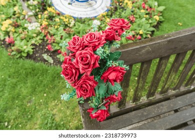 A bouquet of red roses on a park bench, horticulture, flowers and nature concept illustration. - Powered by Shutterstock