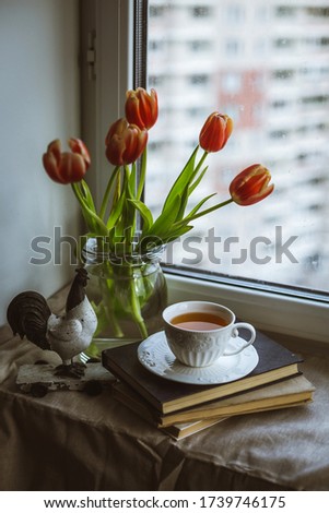 Still life with cup of tea at the window