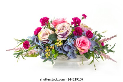 Bouquet of rose, hydrangea, berry and carnation flowers in ceramic pot