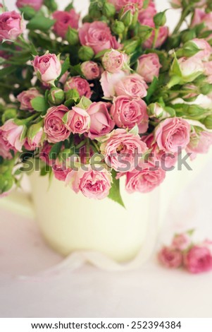 Similar – Woman decorated large bouquet of flowers with roses in vase