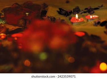 Bouquet of roses, candles and gifts, card for February 14, St. Valentine, March 8, wedding, birthday, mother's day, blurred background, bokeh.