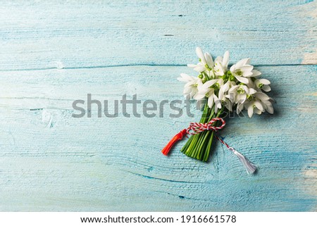Bouquet of snowdrops on a blue background. gift for March 8, mother's day.
