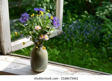 Bouquet Of Summer Wildflowers In A Vase On A Wooden Window Sill. Still Life On The Window Of An Old Country House, Summer Cottage.