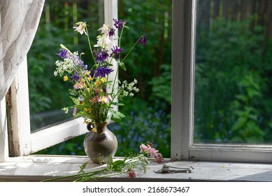 Bouquet Of Summer Wildflowers In A Vase On A Wooden Window Sill. Still Life On The Window Of An Old Country House, Summer Cottage.