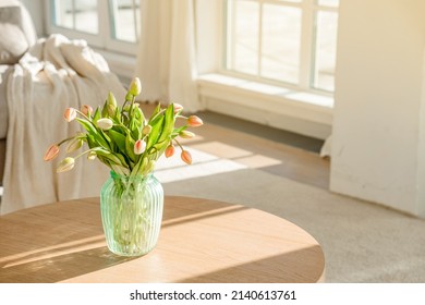 A Bouquet Of Tulips In A Beautiful Vase At Home In A Bright Modern Interior On A Wooden Table. Spring Concept