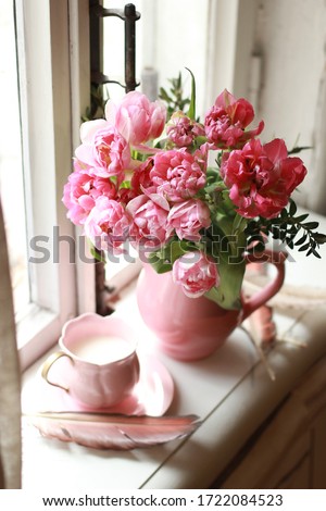 Similar – Woman decorated large bouquet of flowers with roses in vase