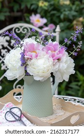 bouquet of white and pink peony flowers in vintage vase - Shutterstock ID 2162317177