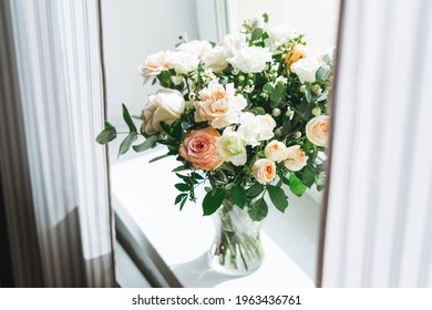 Bouquet Of White And Pink Roses, Greens And Other Flowers On The Window Sill At Home