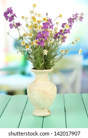 Bouquet Of Wild Flowers In Vase, On Bright Background