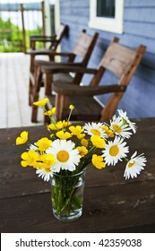 Bouquet of wildflowers on a rustic table at country cottage