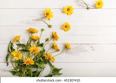 Bouquet Yellow Daisy Flowers On Wooden Table. High Top View.