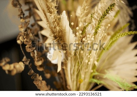 bouquet of yellow dried flowers. bouquet of dried flowers of golden color, close-up