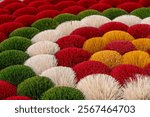 Bouquets of colorful incense sticks made by hand in a small village near Hanoi in Vietnam.