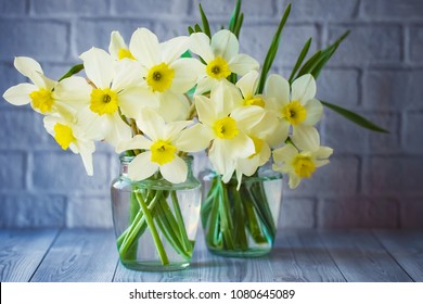 bouquets of daffodils close up. daffodils in vases. background with daffodils. - Powered by Shutterstock