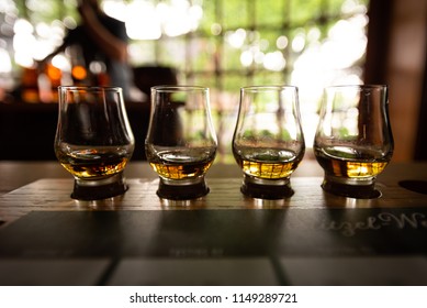 Bourbon Flight With Selective Focus On Four Samples