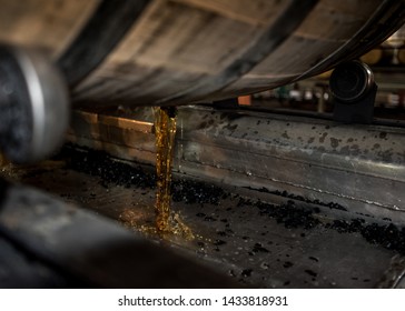 Bourbon Pouring Out Of Barrel In A Kentucky Distillery