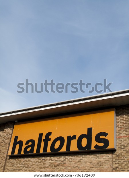 Bourne Retail\
Park, Salisbury, Wiltshire, England - August 28, 2017: Halfords\
Group plc, British retailer of car parts, camping, touring\
equipment, bicycles MOT service and\
repairs