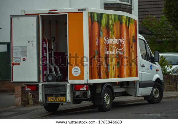 Bournemouth, UK-April 27\
2021: A home delivery van of Sainsbury\'s retailer stations in a\
residential area  