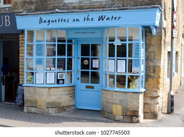 BOURTON ON THE WATER, UK - JUNE 21, 2017: A View Outside The Sandwich Shop, Baguettes On The Water In Bourton On The Water, Gloucestershire, UK