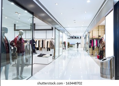 Boutique display window with mannequins in fashionable dresses  - Shutterstock ID 163448702