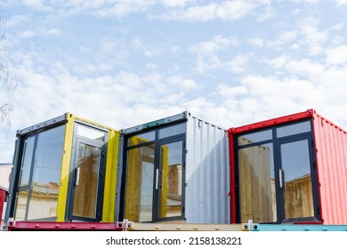 The boutique store is made of sea containers, the design project of the shopping complex on the street. Euro doors are plastic windows. High quality photo