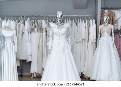 Boutique Wedding Dress On Mannequin In Bridal Store. Fashion Concept