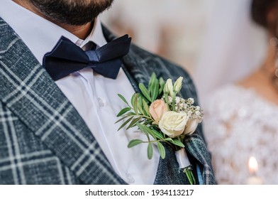 Boutonniere on the groom's jacket