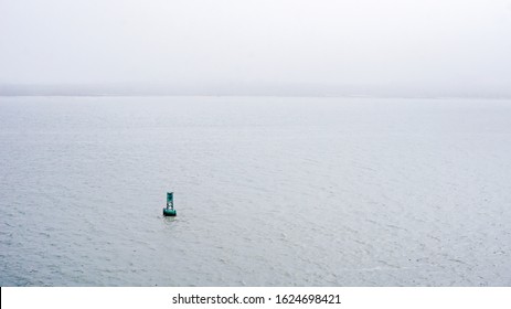 A Bouy Floats In A Ship Channel.                