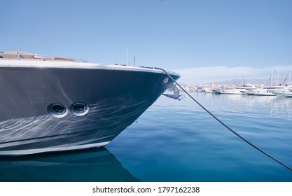 The bow of big yacht moored at marina.