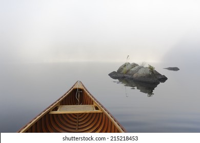 Bow of a Cedar Canoe and Rocks on a Misty Morning - Haliburton, Ontario, Canada