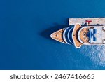 Bow of cruise ship near the pier, aerial top down view