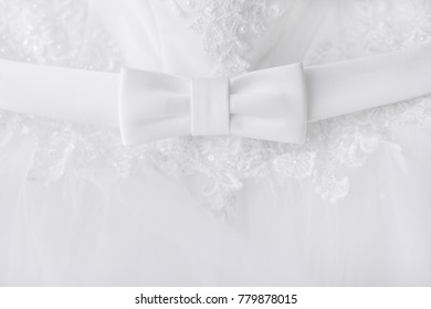 Bow Detail In White Wedding Dresses. Texture Of White Wedding Dresses Lace Tulle. Background.